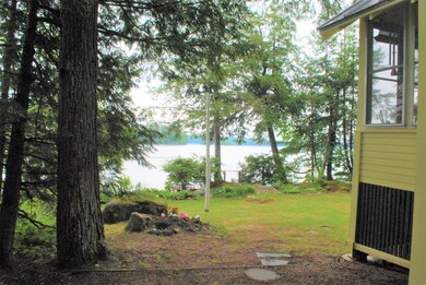 Landscaped Yard View with camp in image