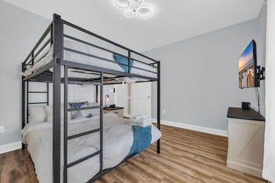 Bedroom with wood finished floors