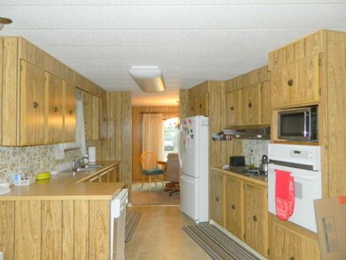 Kitchen Opening to Formal Dining