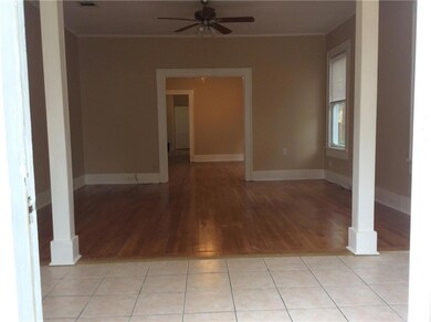 Large tiled entry open to living room, dining room