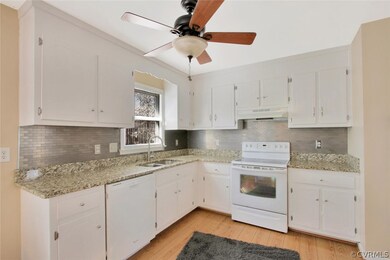 Bright open kitchen with granite counter tops.
