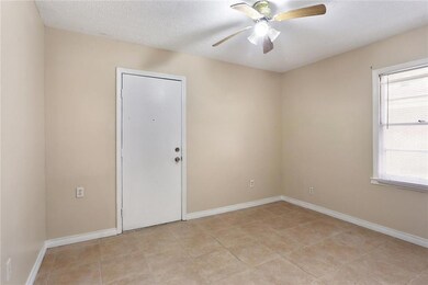 Bedroom 2 - Door leads to back patio
