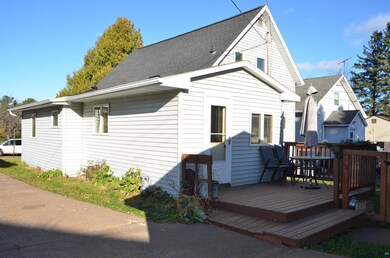 Rear view of house with a wooden deck