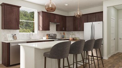 Kitchen with wood-type flooring, stainless steel a