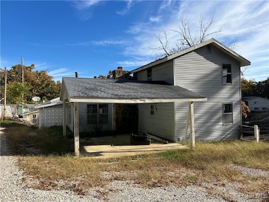 Front of Home with Carport.