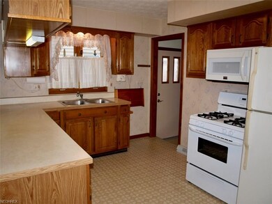 Kitchen stove, microwave, refrigerator stay. Door 