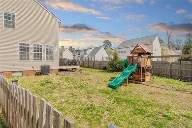 View of yard featuring a residential view, cooling