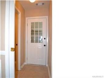 A pocket door conceals the entrance to the laundry