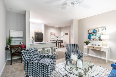 Living room featuring light colored carpet and a c