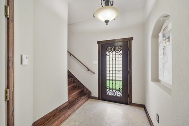 Included is a wood-stained and wrought iron front