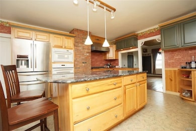 Kitchen with custom cabinets. And large for entert