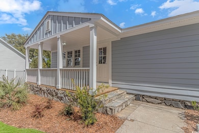 View of exterior entry with a porch and board and 