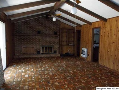 Large family room with wood burning insert with bl