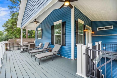 Porch with ceiling fan and outdoor dining area