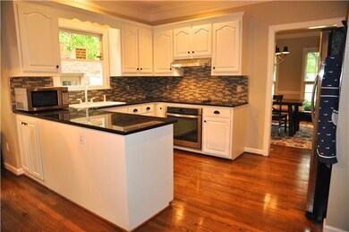 Granite Countertops and Glass Tiled Backsplash
