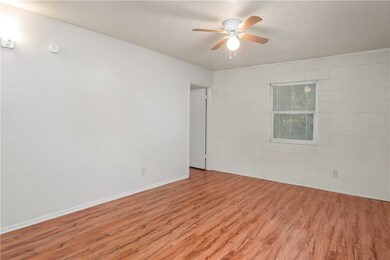 Spare room with light wood-style floors, ceiling f