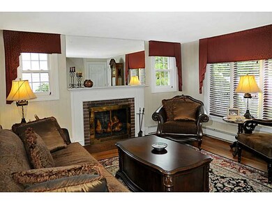 Living Room. wood burning fireplace hardwood floor