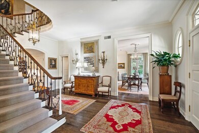 Foyer with a chandelier, dark hardwood / wood-styl
