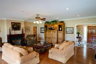 Cozy Gas Fireplace In The Den With Ample Furniture