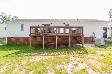 REAR EXTERIOR W/ 12X10 DECK, SMALL PAVED GRILL PAT