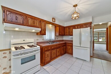Huge, sunny kitchen with porcelain tile floor