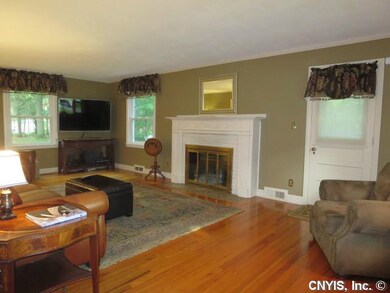 Living Room. To a generous living room with fire p