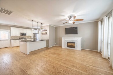 The home features an open-concept first-floor living with newly refinished hardwood floors. Included is a Nest thermostat for smarthome climate control.