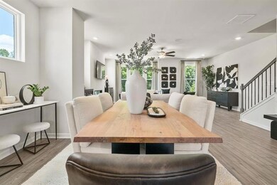 Dining area featuring light wood-style floors, stairway, recessed lighting, and a ceiling fan
