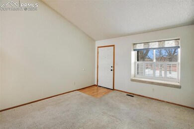 Front door entryway and living area to include pic