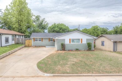 Ranch-style house featuring fence, concrete drivew