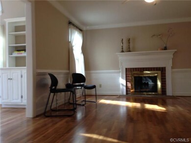 Family Room with Chair Rail, Mouldings and firepla
