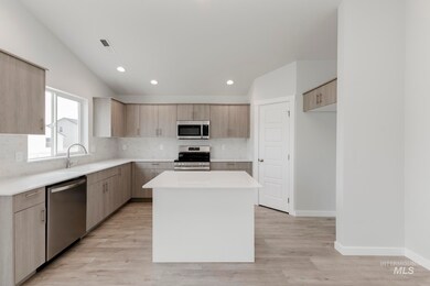 Kitchen with a center island, backsplash, stainless steel appliances, modern cabinets, and recessed lighting