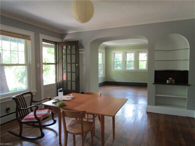 The spacious dining room with built-in shelves and