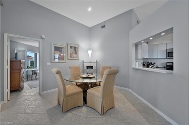 Dining space with a high ceiling