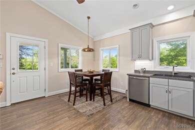 Dining room featuring crown molding, baseboards, v