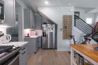 Kitchen featuring appliances with stainless steel