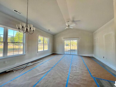 Empty room with ceiling fan with notable chandelie