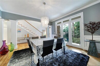Bright Dining rm w/pillars opens to Great rm.