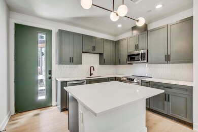 Kitchen featuring stainless steel appliances, a s
