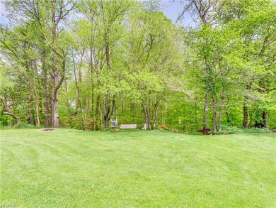 Beautiful backyard. Acreage extends into the woods with a creek that runs through. Plant yourself on a hammock under a tree by a creek. Perfect!