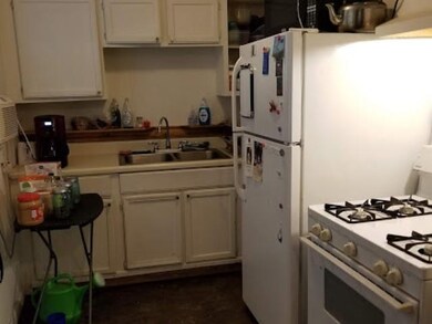 The cozy kitchen includes gas cooking and the frid