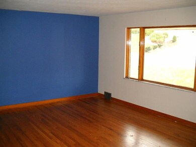 Living Room with Hardwood & Bright Picture Window