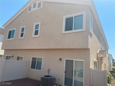 Back of house featuring stucco siding