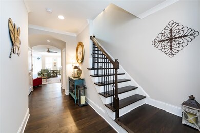 The wood floors carry you through the main living area and up the stairs!