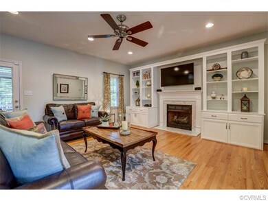 Large family room with hardwood floors, gas firepl
