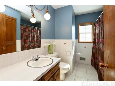 Upper level bathroom with private master half bath
