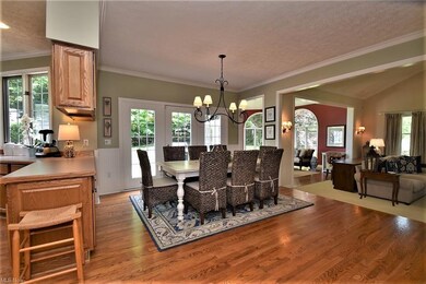 Large eat-in kitchen with hardwood floors, crown m