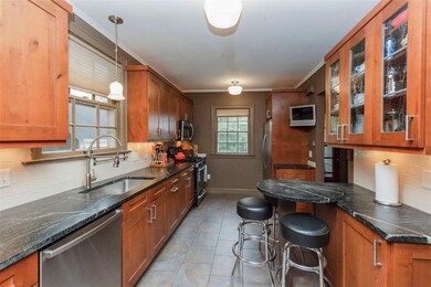Stainless steel appliances and a gas stove make preparing meals a delight.
