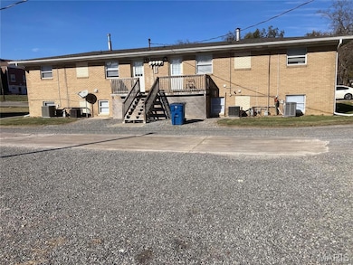 View of property featuring stairway