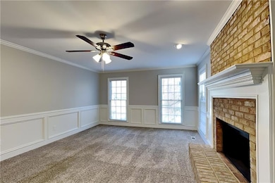Unfurnished living room with a brick fireplace, ce